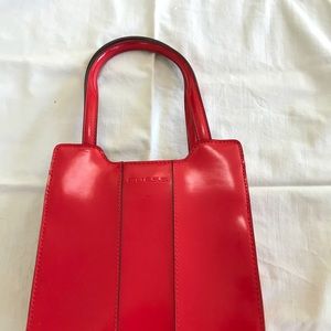 Red leather handbag by GUESS